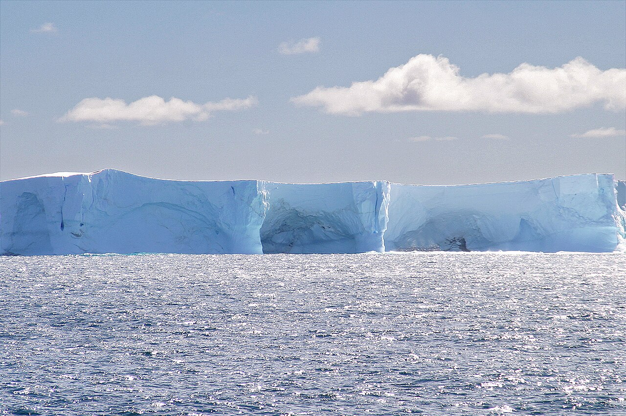 Large tabular iceberg floating in Antarctic waters